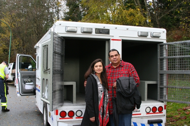 Rueben George and Melina Laboucan-Massimo of Greenpeace Canada awaiting Amy George on Ridgeview Drive. Photo by Peter Morelli.
