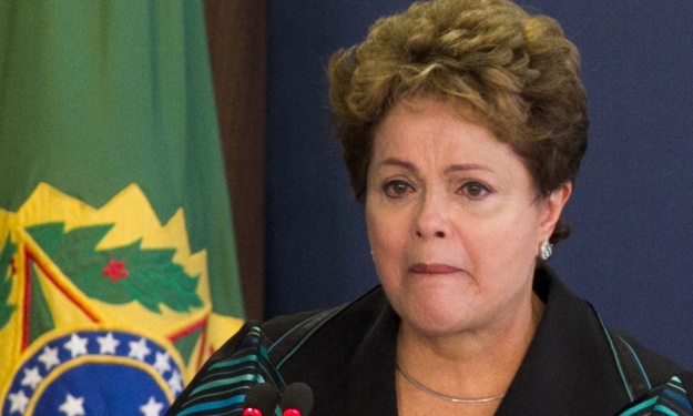 Brazil’s President Dilma Rousseff is visibly moved while presenting the final report of the National Truth Commission in Brasilia. Photograph: Agencia Estado/Xinhua Press/Corbis