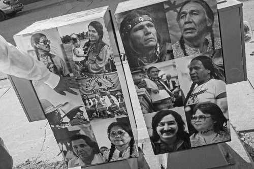Images of AIM leaders are posted on the side of a utility box, part of a community art project to showcase Native American culture. Among those pictured are Bellecourt, left box, top left; Dennis Banks, an activist and co-founder of AIM, right box, top left; and Leonard Peltier, convicted in the shooting deaths of two FBI agents at Wounded Knee in a controversial trial that is still disputed, right box, bottom left.